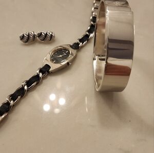 Trifari earrings, Guess Watch, and a Chrome Bracelet.